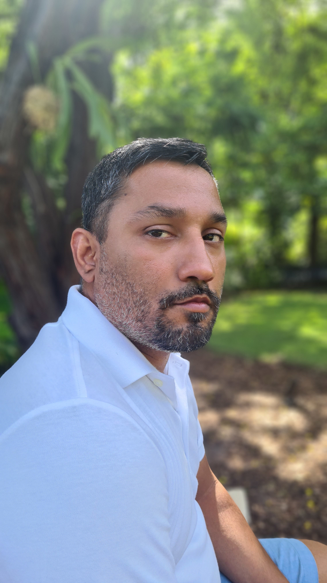 Joel in a botanical garden.